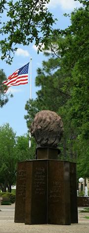 image of Mirabeau statue and US flag on a sunny day