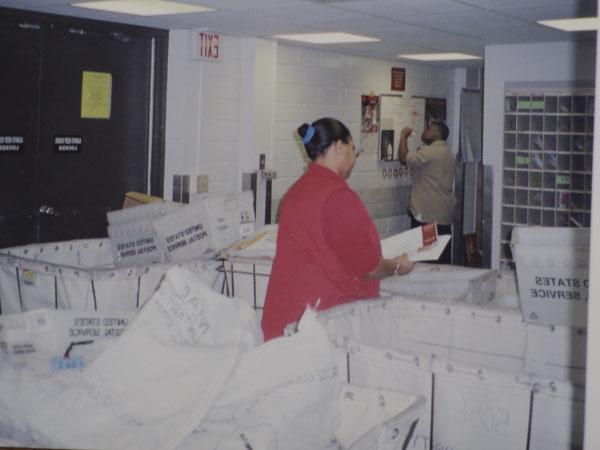 Cynthia Perkins sorting mail